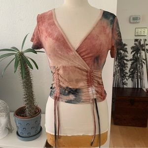 Bae City short sleeved tie-dye crop top.  V-neck. Adjustable scrunched front